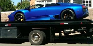 Image of Luxury Towing with a Blue car,ALL Above Towing LLC,Tow Truck Company